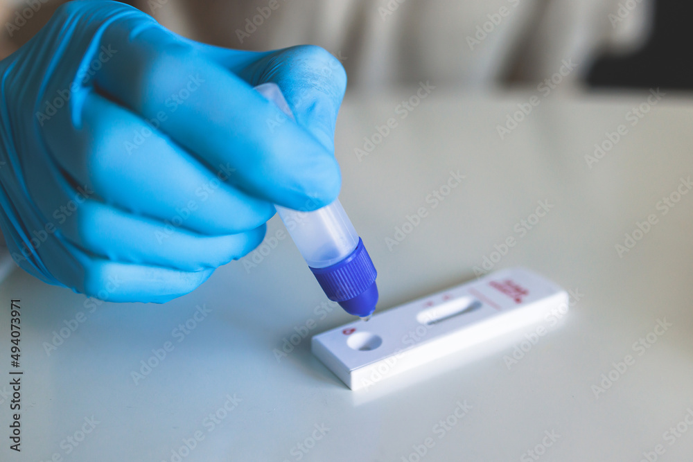 Process of express fast coronavirus covid Antigen AG PCR testing examination at home, COVID-19 swab collection kit, test tube for taking OP NP patient specimen sample, testing carried out