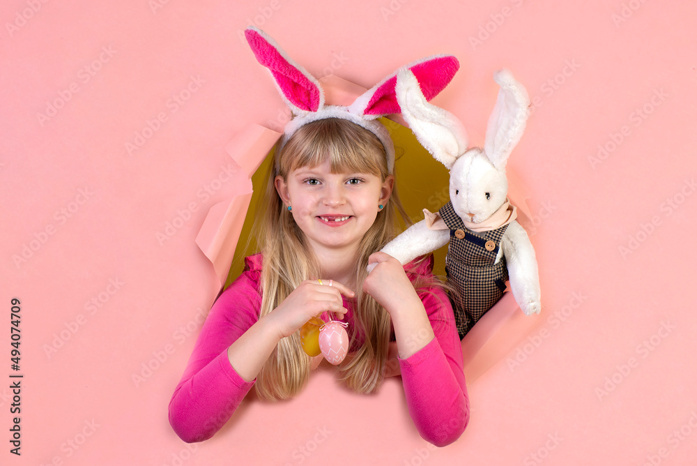 Cute little girl on Easter holiday with a rabbit costume Cute little girl on Easter holiday with a rabbit costume
