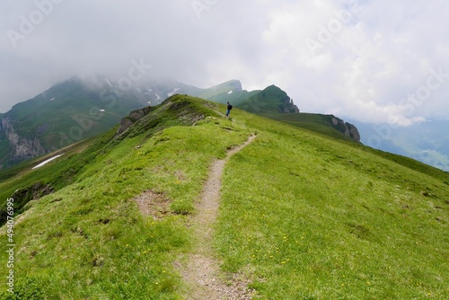 Hikers in Flumser Kleinberg region. St. Gallen, Switzerland. photo