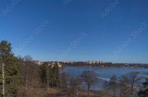 Bridge view over the bay Ulvsundasjön with apartment houses at the waterfront a sunny spring day in Stockholm © Hans Baath