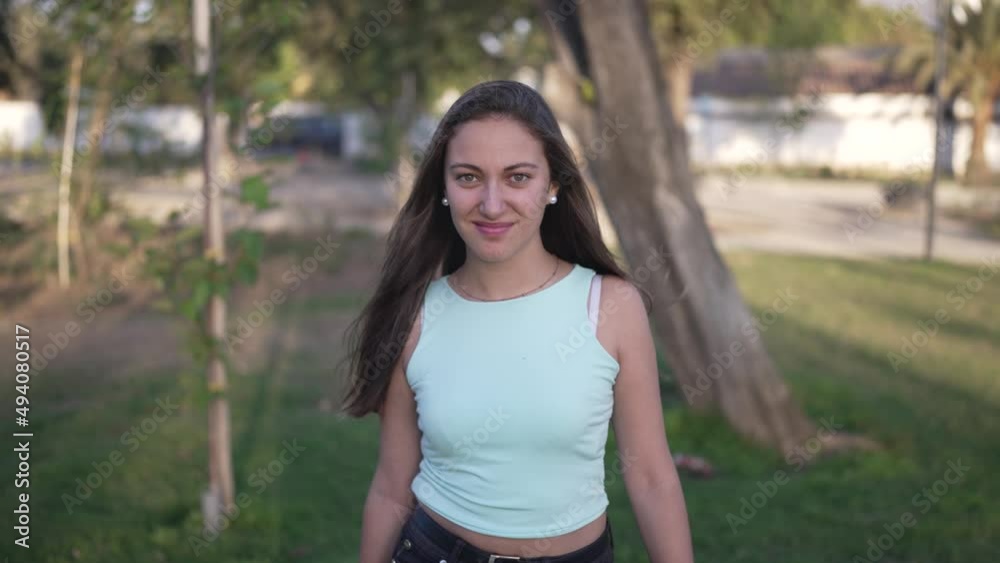 a cute white girl smiling and walking in medium shot to the front a cute white girl smiling and walking in medium shot to the front