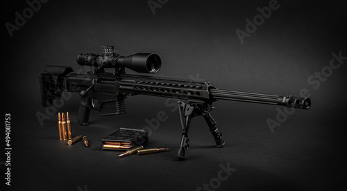 Photo Modern powerful sniper rifle with a telescopic sight mounted on a bipod