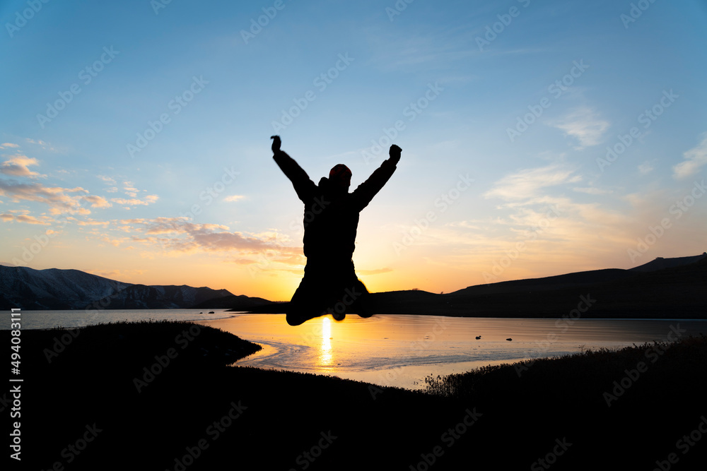 Silhouette of a person in the sunset Silhouette of a person in the sunset