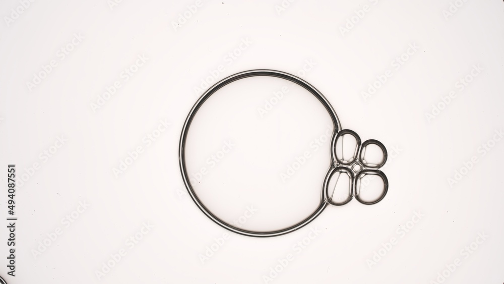 Transparent bubble of hyaluronic acid attracts four connected small ones against grey background | Shot of skin care cream ingredients for skin moisturizing concept Transparent bubble of hyaluronic acid attracts four connected small ones against grey background | Shot of skin care cream ingredients for skin moisturizing concept