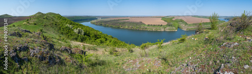 Amazing spring view on the Dnister River Canyon with picturesque rocks, fields, flowers. This place named Shyshkovi Gorby, Nahoriany, Chernivtsi region, Ukraine.