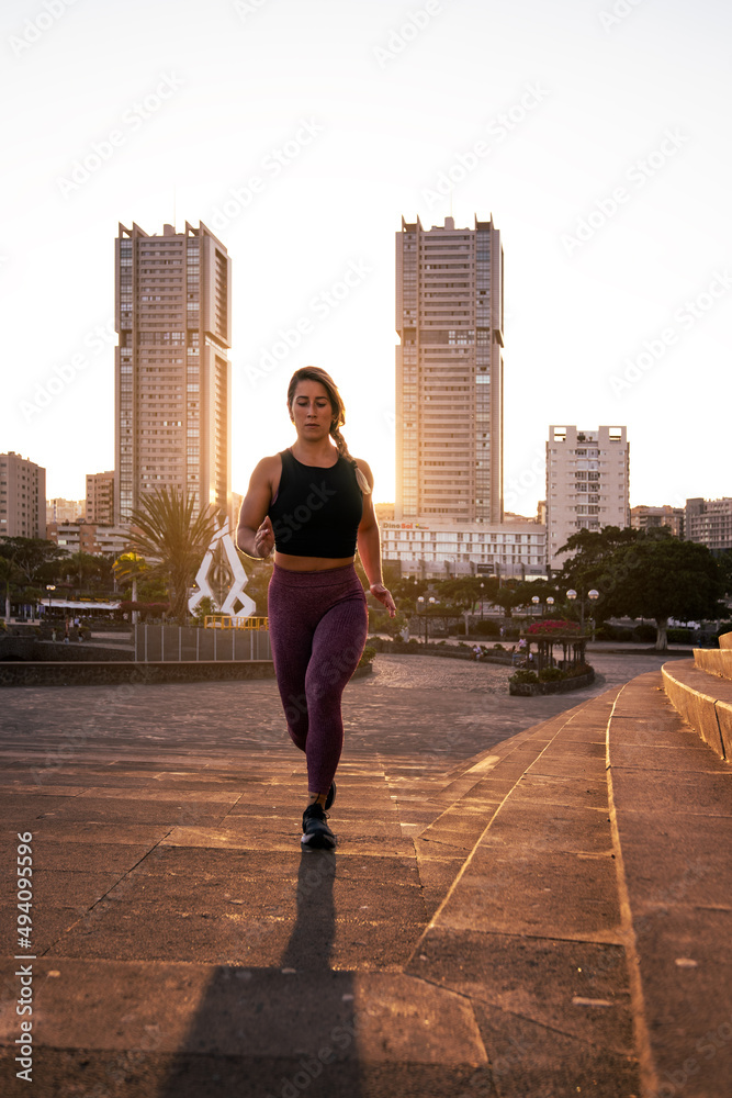 Fitness woman exercising in urban environment