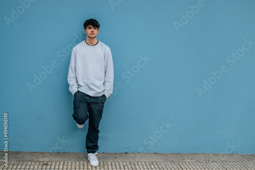 urban style teenager on the wall with copy space