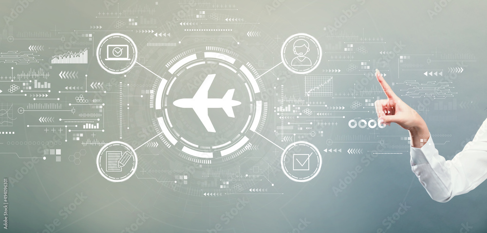 Flight ticket booking concept with hand pressing a button on a gray background Flight ticket booking concept with hand pressing a button on a gray background