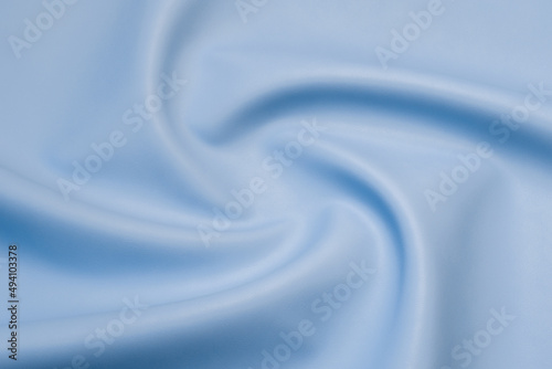 blue artificial leather with waves and folds on PVC base