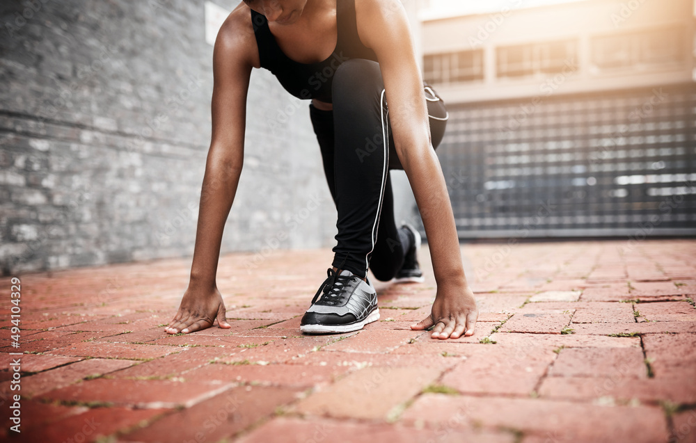 The race is on. Closeup shot of an unrecognizable woman exercising outdoors.