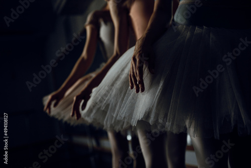 ballet dancers in class hand 