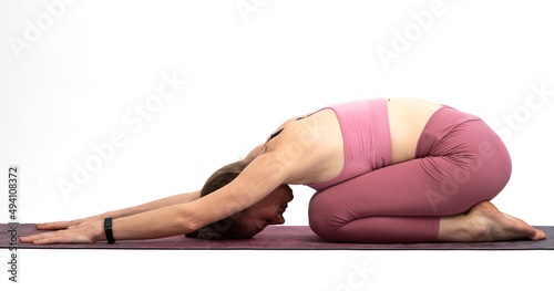 woman doing yoga on a white background balasana or child pose
