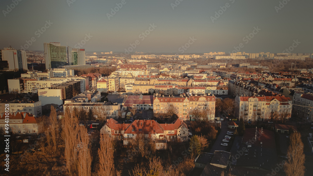 Calm district with houses, top view. Streets, parks and roads. Residential area drone photo. The city of Poznan, Poland.