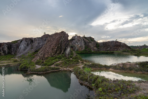Abandoned quarry with beautiful lake in mirror