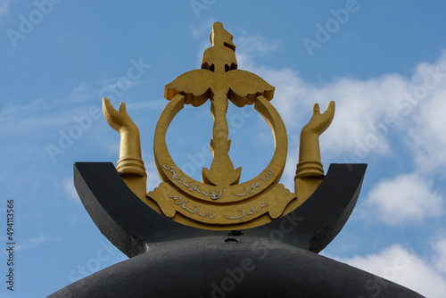 Close up of Brunei emblem, Billionth Barrel Monument resides along the beach in Seria and is a symbol of achievement in Brunei’s oil production.  photo