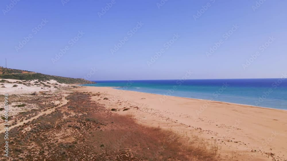 Aerial 4k Karpaz Golden Beach with crystal clear water and sandy coastline in North Cyprus, which offer you tropical exotic beach feeling with its natural untouched beauty in Cyprus Island. Aerial 4k Karpaz Golden Beach with crystal clear water and sandy coastline in North Cyprus, which offer you tropical exotic beach feeling with its natural untouched beauty in Cyprus Island.