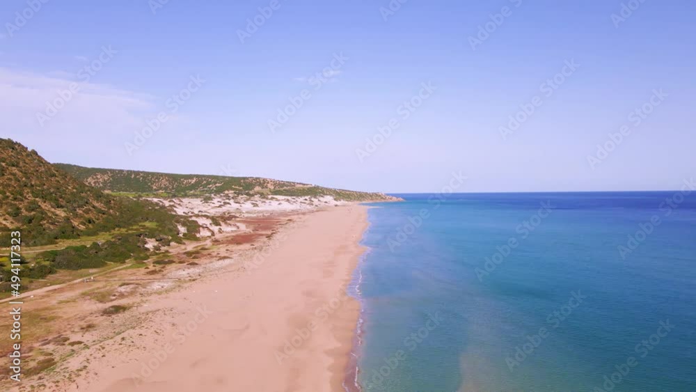 Aerial 4k Karpaz Golden Beach with crystal clear water and sandy coastline in North Cyprus, which offer you tropical exotic beach feeling with its natural untouched beauty in Cyprus Island. Aerial 4k Karpaz Golden Beach with crystal clear water and sandy coastline in North Cyprus, which offer you tropical exotic beach feeling with its natural untouched beauty in Cyprus Island.