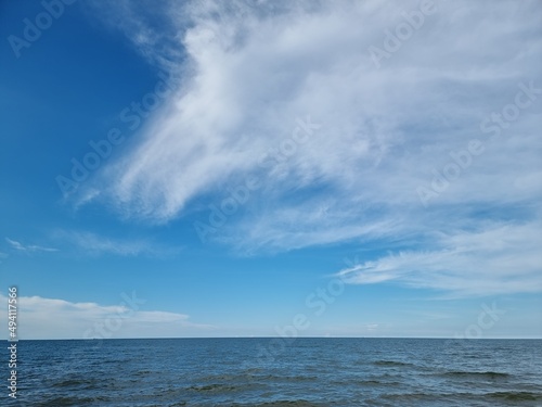 Blue sea waters and blue sky horizon
