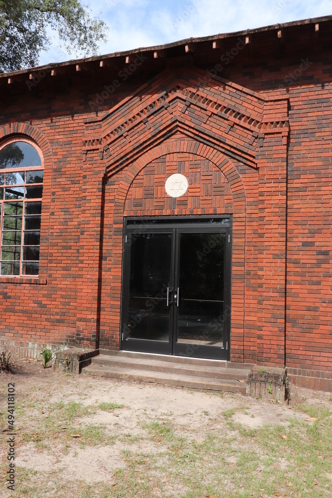 Fototapeta premium Red Brick Building in Graveyard