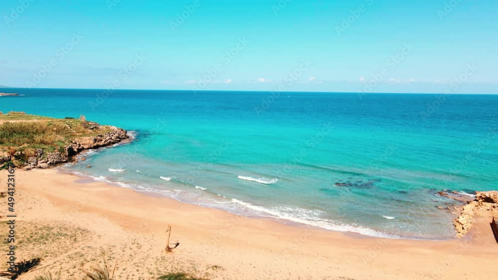 Aerial 4k Sandy Beach with crystal clear water and sandy coastline in North Cyprus, which offer you tropical exotic beach feeling with its natural untouched beauty in Cyprus Island. Aerial 4k Sandy Beach with crystal clear water and sandy coastline in North Cyprus, which offer you tropical exotic beach feeling with its natural untouched beauty in Cyprus Island.