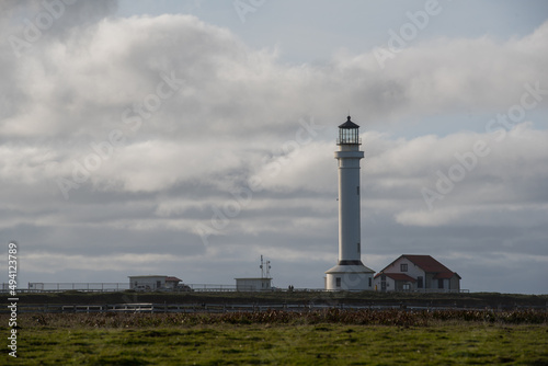 Point Arena Lighthouse on the cliffs with stormy skies