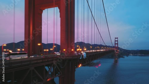Aerial view of the magnificent Golden Gate Bridge with night traffic, 4K USA