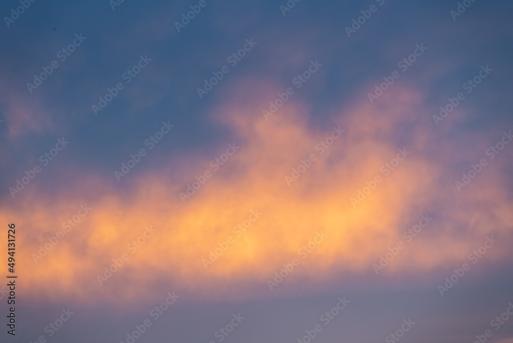 Stunning orange fluffy clouds with blue sky background for replacement, editing use