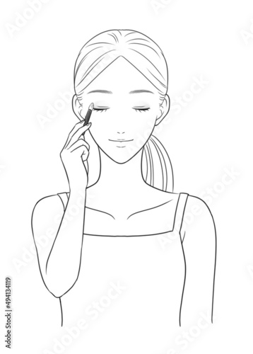 Woman applying eyeshadow (grayscale)