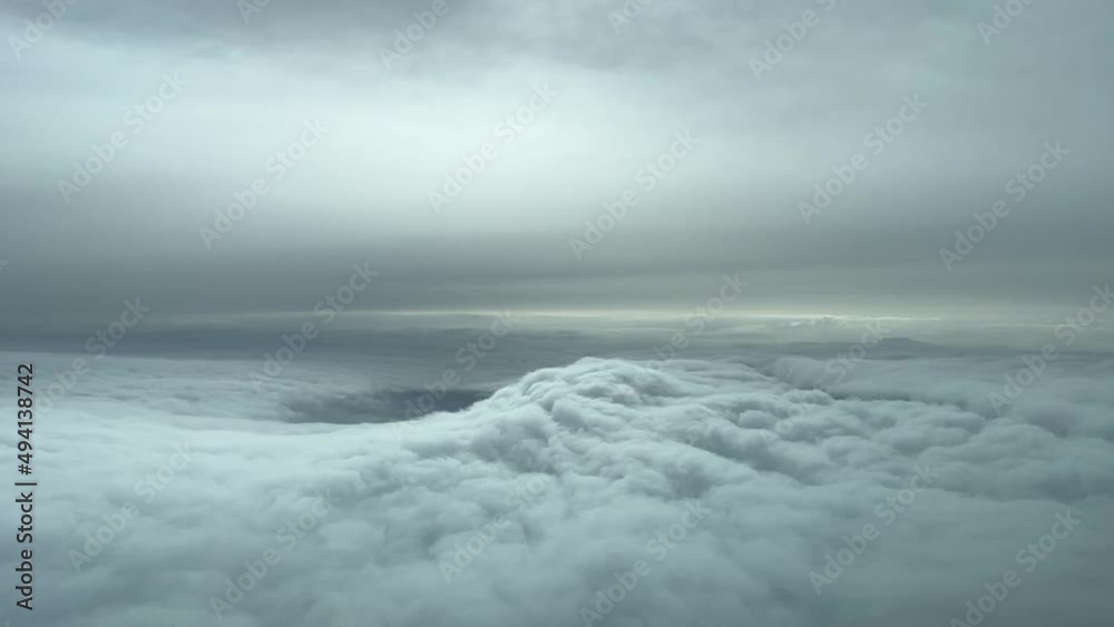Aerial view from a cockpit flying trough nice winter snow clouds Aerial view from a cockpit flying trough nice winter snow clouds