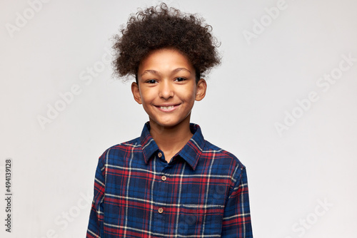 Canvastavla Head and shoulders studio shot of sweet handsome dark-skinned male kid of 13 wit