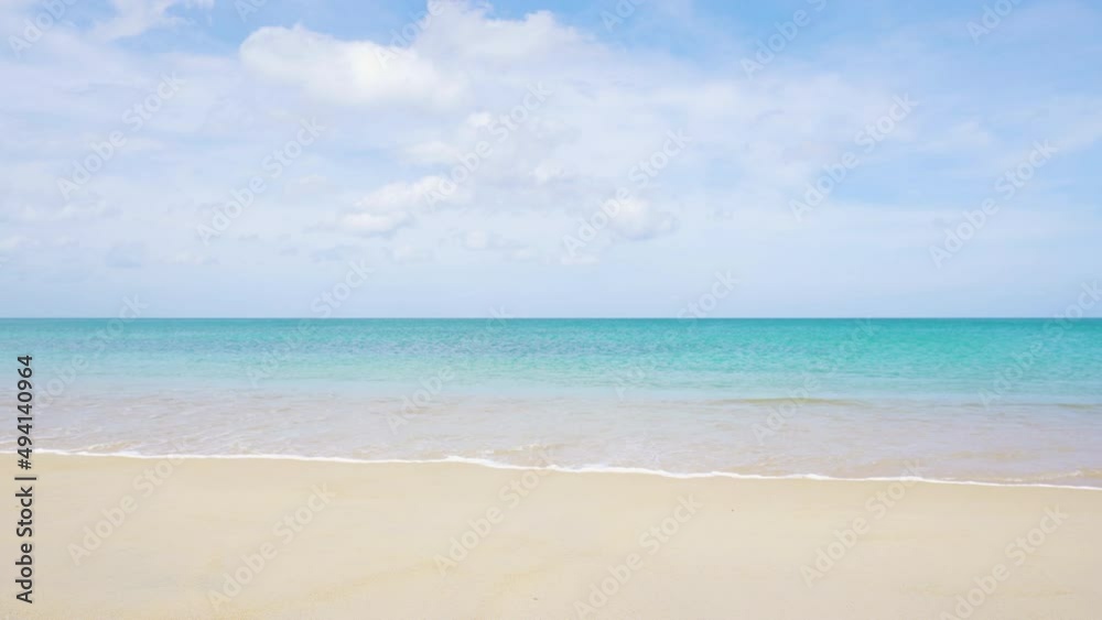 Sea golden sand clear beach sunny. blue sky white clouds daytime. Waves water smoothly shore side. Sea golden sand clear beach sunny. blue sky white clouds daytime. Waves water smoothly shore side.
