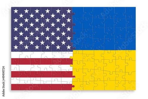 Puzzle made from United States of America and Ukraine flags. Relationship between United States of America and Ukraine