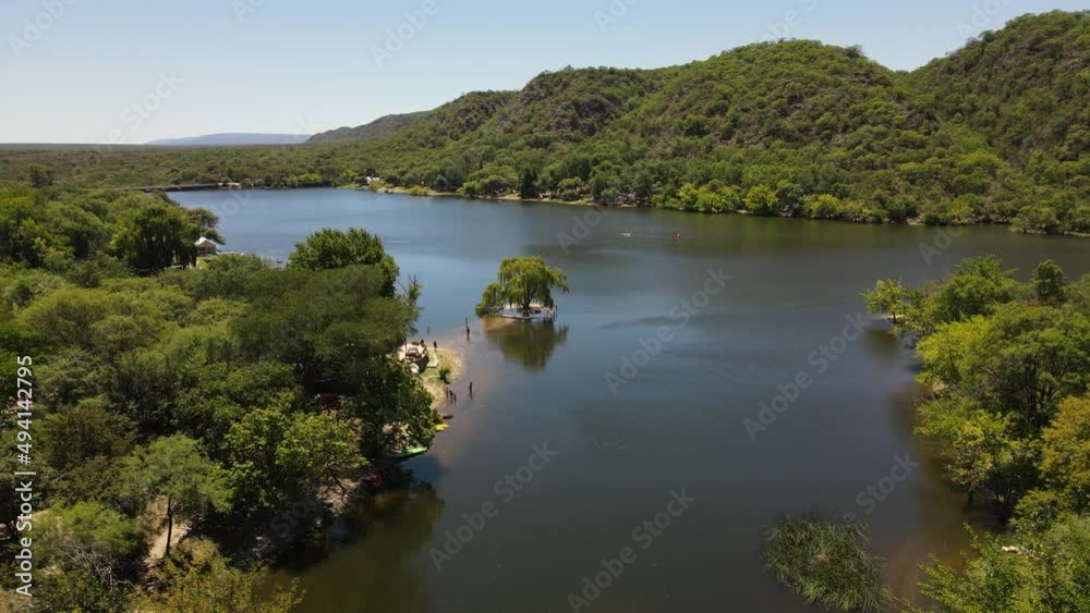 Aerial view of natural lake showing group kayaks ready for paddling in nature scenery of Argentina during summer Aerial view of natural lake showing group kayaks ready for paddling in nature scenery of Argentina during summer