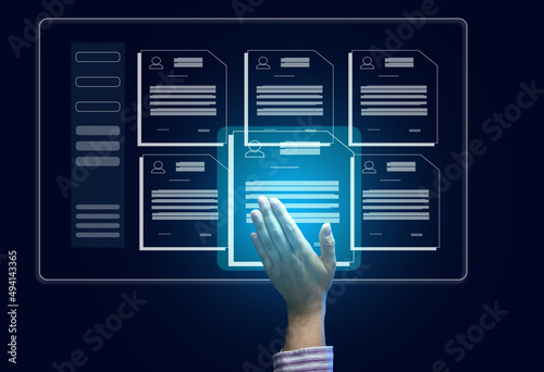 female hand selects a candidate's resume on a virtual screen. The concept of finding employees, career advancement