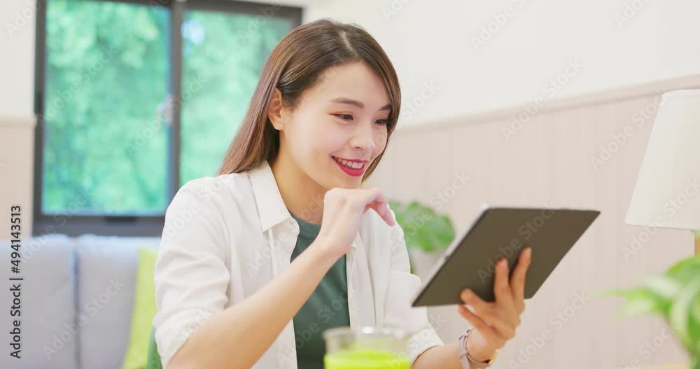 woman using tablet at home