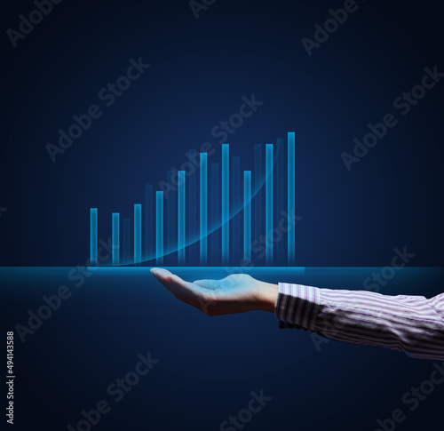 holographic graph with growing indicators and a woman's hand. Business growth concept, profitable startup, profitable business strategy