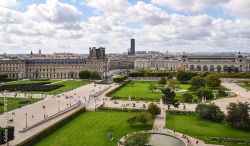Beautiful panoramic view of the Tuileries gardens and the cityscape on a cloudy summer day. Paris, France photo