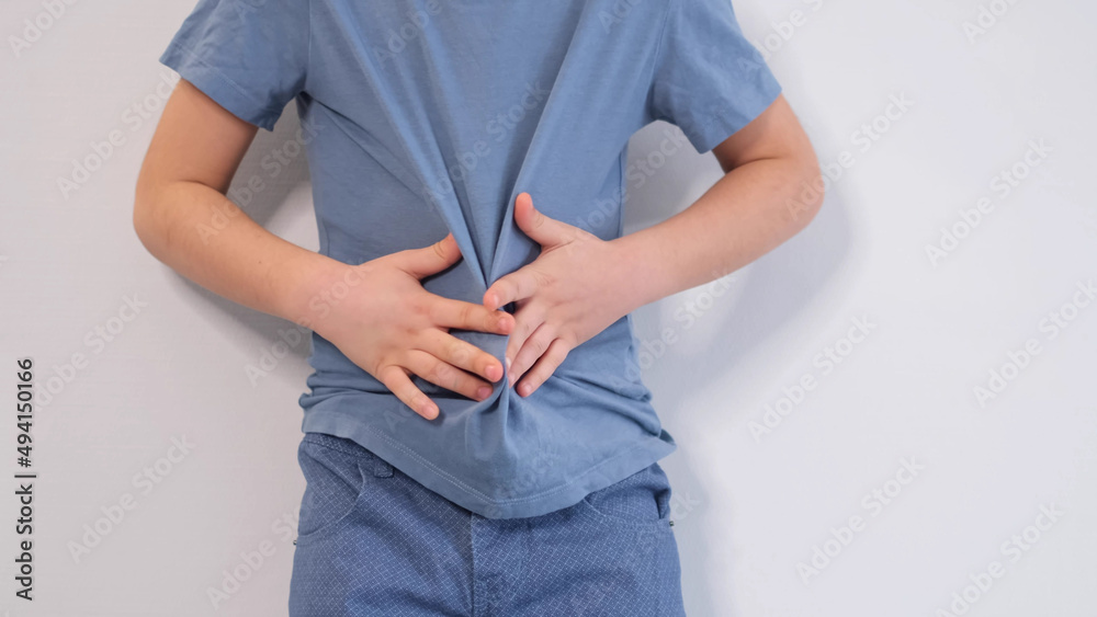 little boy experiences abdominal pain. Baby's medication and health