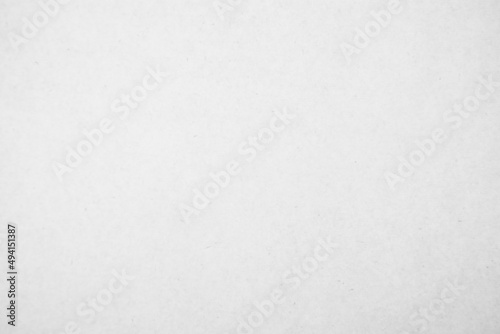 White recycled craft paper texture as background. Grey paper texture, Old vintage page or grunge vignette of old cardboard.
