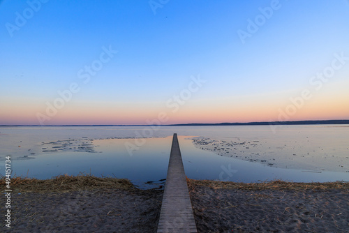 Fototapeta Naklejka Na Ścianę i Meble -  sunset on the beach in winter giżycko