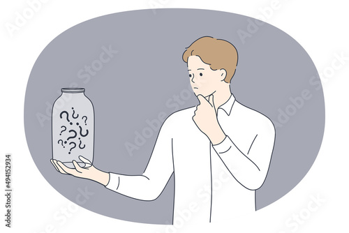 Asking doubt and frustration concept. Young man standing thinking and looking jar full of question marks inside feeling frustrated touching chin vector illustration 