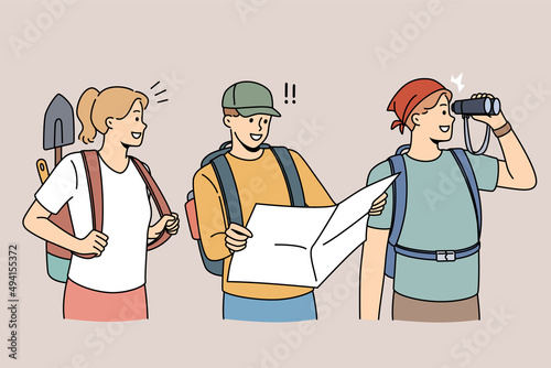 Happy archeologists with tools and map ready for treasure or historic artifact hunting. Smiling diverse researchers or historians with archeological equipment. Flat vector illustration. 