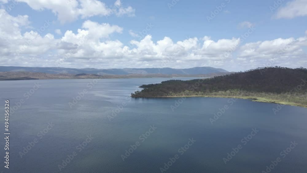 Calm Waters Of Quaids Dam, Reservoir Near Big Mitchell Creek Reserve In Queensland, Australia. aerial pullback Calm Waters Of Quaids Dam, Reservoir Near Big Mitchell Creek Reserve In Queensland, Australia. aerial pullback