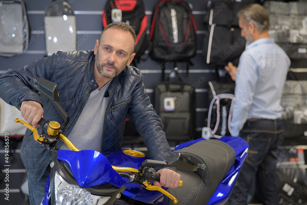 man at a motorcycle salon man at a motorcycle salon