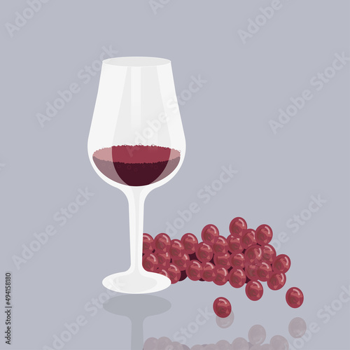 a glass of red wine,  red grapes