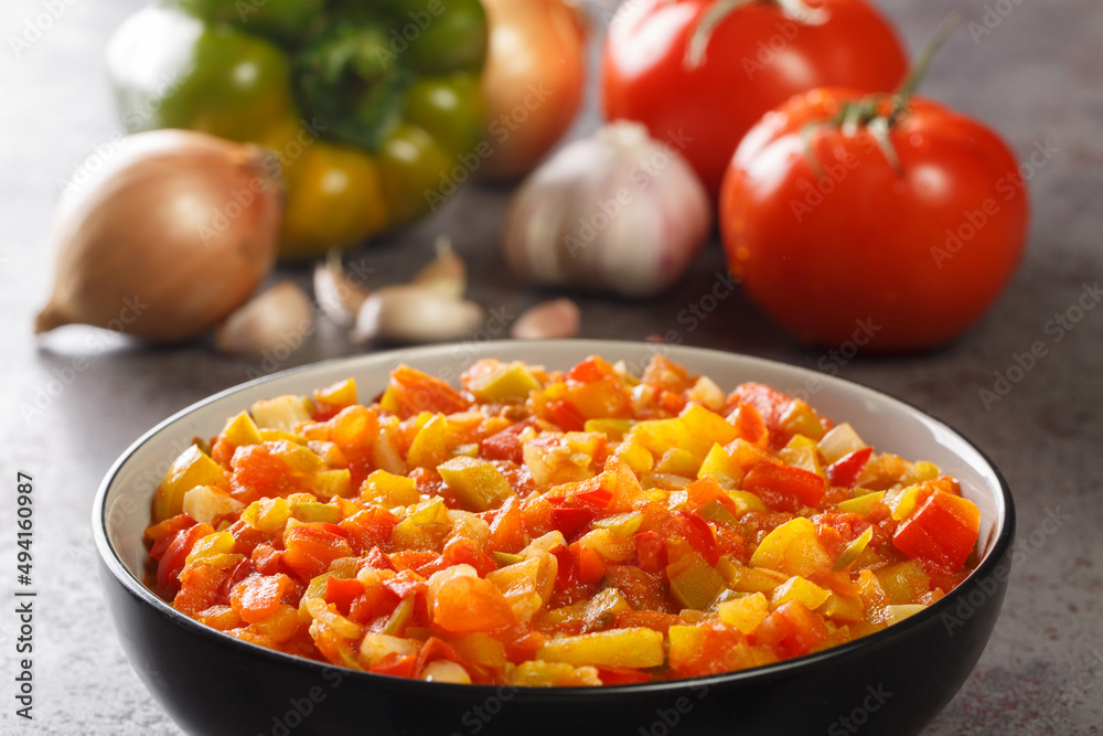 Homemade sofrito sauce from peppers, tomatoes, garlic and onions close