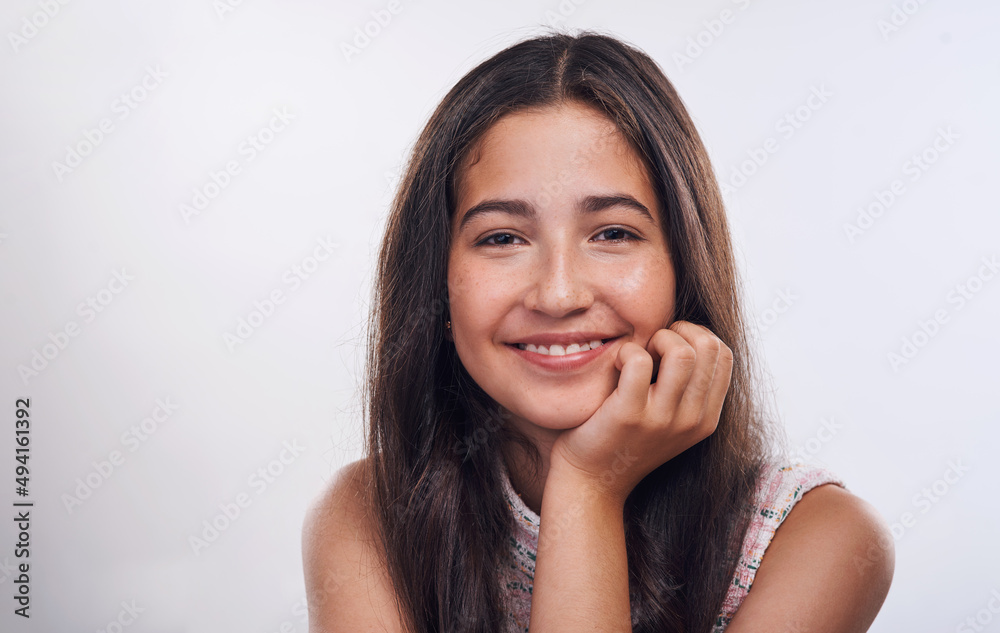 Confidence is the new beautiful. Cropped portrait of an attractive teenage girl standing alone against a white background in the studio. Confidence is the new beautiful. Cropped portrait of an attractive teenage girl standing alone against a white background in the studio.
