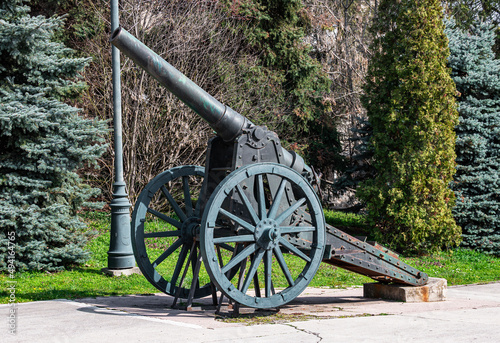 Cannon from World War II on display in the public park. Steel cannon used by the Romanian army in the world war. photo