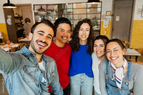 Multiracial group of young people taking selfie indoor