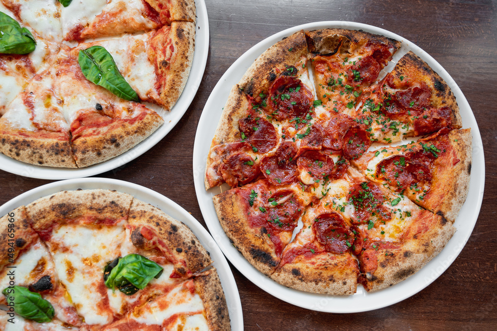 Top view three delicious Italian pizzas on the table. Top view three delicious Italian pizzas on the table.